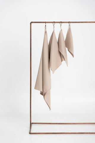 beige vannas dvieļi