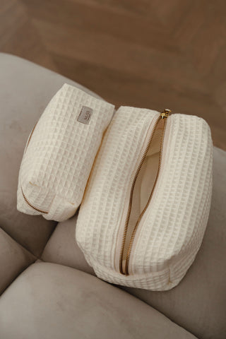 White and gold cosmetic pouch, bag